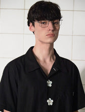 Load image into Gallery viewer, UNALLOYED Button Flower Half Shirt Black