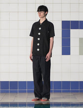 Load image into Gallery viewer, UNALLOYED Button Flower Half Shirt Black